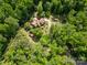 Aerial view of a home surrounded by lush green trees and vegetation, showcasing its secluded location at 1160 Walton Pl, Salisbury, NC 28146