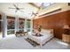 Bright bedroom with wood-paneled wall, vaulted ceiling, and multiple windows at 1160 Walton Pl, Salisbury, NC 28146