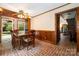 Cozy breakfast nook with brick floor, wood-paneled walls, and natural light at 1160 Walton Pl, Salisbury, NC 28146