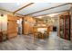 Open-concept kitchen and dining area with wood cabinets and flooring at 1160 Walton Pl, Salisbury, NC 28146