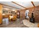 Rustic dining area with brick accent wall and wood-burning stove at 1160 Walton Pl, Salisbury, NC 28146