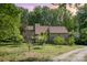 Exterior view of home with mature trees, large front yard, and gravel driveway at 1160 Walton Pl, Salisbury, NC 28146