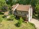 View of home with a wooden deck, two-car garage, grill shelter and a neatly manicured lawn at 1160 Walton Pl, Salisbury, NC 28146