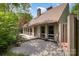 Rear exterior view of the home with a gravel area, deck and multiple windows at 1160 Walton Pl, Salisbury, NC 28146
