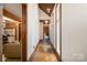 Hallway with hardwood flooring, wood trim, and ample natural light at 1160 Walton Pl, Salisbury, NC 28146