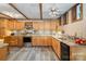 Bright kitchen featuring stainless steel appliances, wood cabinets, and mosaic backsplash at 1160 Walton Pl, Salisbury, NC 28146