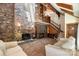 Spacious living room featuring brick fireplace, staircase, and second story balcony at 1160 Walton Pl, Salisbury, NC 28146