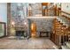 Spacious living room with brick fireplace, brick floors, and second story balcony at 1160 Walton Pl, Salisbury, NC 28146