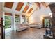 Bright living room with brick floors, vaulted ceilings, and multiple windows at 1160 Walton Pl, Salisbury, NC 28146