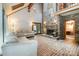 Bright living room with brick floors, fireplace, and sliding door to the backyard at 1160 Walton Pl, Salisbury, NC 28146