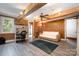 Comfortable living room featuring wood-paneled walls, a ceiling fan, and a built-in desk area at 1160 Walton Pl, Salisbury, NC 28146