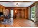 A spacious office features beautiful wood paneling, hardwood floors, a decorative fireplace, and an abundance of natural light at 1160 Walton Pl, Salisbury, NC 28146