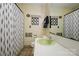 Unique bathroom featuring an olive sink, decorative shower curtain and a decorative outhouse sign at 13030 Mayes Rd, Huntersville, NC 28078