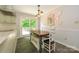 Eat-in dining area with a table and a door to an outdoor area at 13030 Mayes Rd, Huntersville, NC 28078