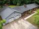 Overhead view of the home featuring an attached two-car garage and beautiful landscaping at 13030 Mayes Rd, Huntersville, NC 28078