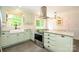 Bright kitchen featuring stainless steel appliances and plentiful counter space at 13030 Mayes Rd, Huntersville, NC 28078