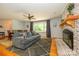 Spacious living room with fireplace, hardwood floors, and an open floor plan at 13030 Mayes Rd, Huntersville, NC 28078