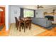 Open concept living room with hardwood floors, fireplace, and a large window at 13030 Mayes Rd, Huntersville, NC 28078