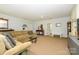 Spacious living room with carpet floors and a comfortable seating area at 13030 Mayes Rd, Huntersville, NC 28078