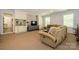 Cozy living room area featuring built-in shelving and a comfortable sofa at 13030 Mayes Rd, Huntersville, NC 28078