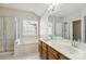 Primary bathroom with double sink vanity, soaking tub, separate shower, and natural light at 1308 Pennington Nw Pl, Concord, NC 28027
