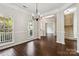 Dining area with hardwood flooring and natural light through large windows at 1308 Pennington Nw Pl, Concord, NC 28027