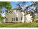 This home boasts large windows, an expansive yard, and neutral siding, offering great curb appeal at 1308 Pennington Nw Pl, Concord, NC 28027