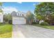 Charming two-story home with a well-manicured front yard and attached two-car garage at 1308 Pennington Nw Pl, Concord, NC 28027