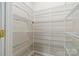 Walk-in pantry with multiple tiers of wire shelving providing ample storage space at 1308 Pennington Nw Pl, Concord, NC 28027