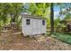 A white storage shed is in the backyard and features an easily accessible ramp at 1308 Pennington Nw Pl, Concord, NC 28027