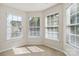 Cozy sunroom filled with lots of windows allowing for plenty of natural light at 1308 Pennington Nw Pl, Concord, NC 28027