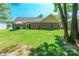 Spacious backyard showcasing the home's brick exterior, patio, and expansive lawn at 137 Ole Eastpointe Dr, York, SC 29745