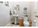 Powder room with pedestal sink, stylish decor, and a warm, inviting ambiance at 137 Ole Eastpointe Dr, York, SC 29745