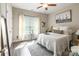 Bright bedroom with modern decor, featuring a large window and hardwood floors at 137 Ole Eastpointe Dr, York, SC 29745