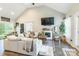Spacious living room featuring high ceilings, a fireplace, and stylish decor for comfortable living at 137 Ole Eastpointe Dr, York, SC 29745