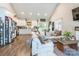 Bright, open-concept living room featuring a vaulted ceiling, wood floors, and lots of natural light at 137 Ole Eastpointe Dr, York, SC 29745