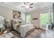Serene bedroom featuring a decorative ceiling fan, neutral color palette, a king-size bed, and natural light at 137 Ole Eastpointe Dr, York, SC 29745