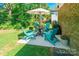 Outdoor patio featuring blue Adirondack chairs, a round table, and umbrella at 137 Ole Eastpointe Dr, York, SC 29745