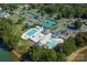 Aerial view of community amenities, including a pool, clubhouse, and tennis courts at 140 Lightship Dr, Mooresville, NC 28117