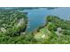 Gorgeous aerial view of a golf course and waterfront homes nestled among lush greenery at 140 Lightship Dr, Mooresville, NC 28117
