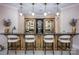 Stylish bar area with custom cabinetry, granite countertops and pendant lighting at 140 Lightship Dr, Mooresville, NC 28117