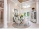 Formal dining room features elegant chandelier, neutral tones, and lots of natural light at 140 Lightship Dr, Mooresville, NC 28117