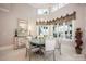 Bright dining room featuring a round glass table, stylish chairs, and large windows with water views at 140 Lightship Dr, Mooresville, NC 28117