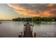 Scenic view of a private dock on a serene lake under a colorful sky at 140 Lightship Dr, Mooresville, NC 28117