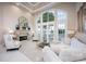 Bright living room boasts large windows, fireplace, and neutral decor with plenty of space at 140 Lightship Dr, Mooresville, NC 28117
