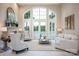 Bright living room boasts large windows, fireplace, and neutral decor with plenty of space at 140 Lightship Dr, Mooresville, NC 28117