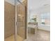 Luxurious bathroom featuring tiled shower with glass door and a separate soaking tub at 140 Villa Lake Dr, Fort Mill, SC 29708