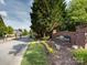 Beacon Knoll Villas entrance featuring a brick sign and manicured landscaping at 140 Villa Lake Dr, Fort Mill, SC 29708