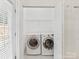 Convenient laundry room with modern washer and dryer, providing practicality and efficiency for everyday living at 140 Villa Lake Dr, Fort Mill, SC 29708