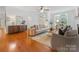 Bright living room with hardwood floors and ample natural light, creating a comfortable and inviting space at 140 Villa Lake Dr, Fort Mill, SC 29708